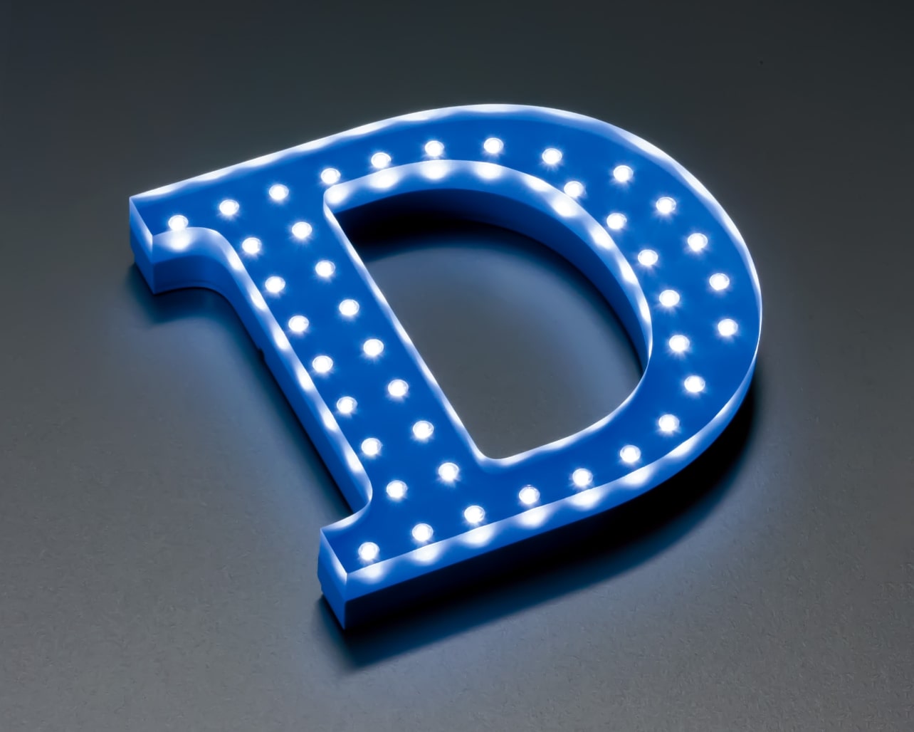 Body: Clear Acrylic 10mm Thick Blue Painted on Back Diffused Lighting Effect on Sides + Acrylic 8mm Thick Black Painted Light Source: SMD-LED Natural White